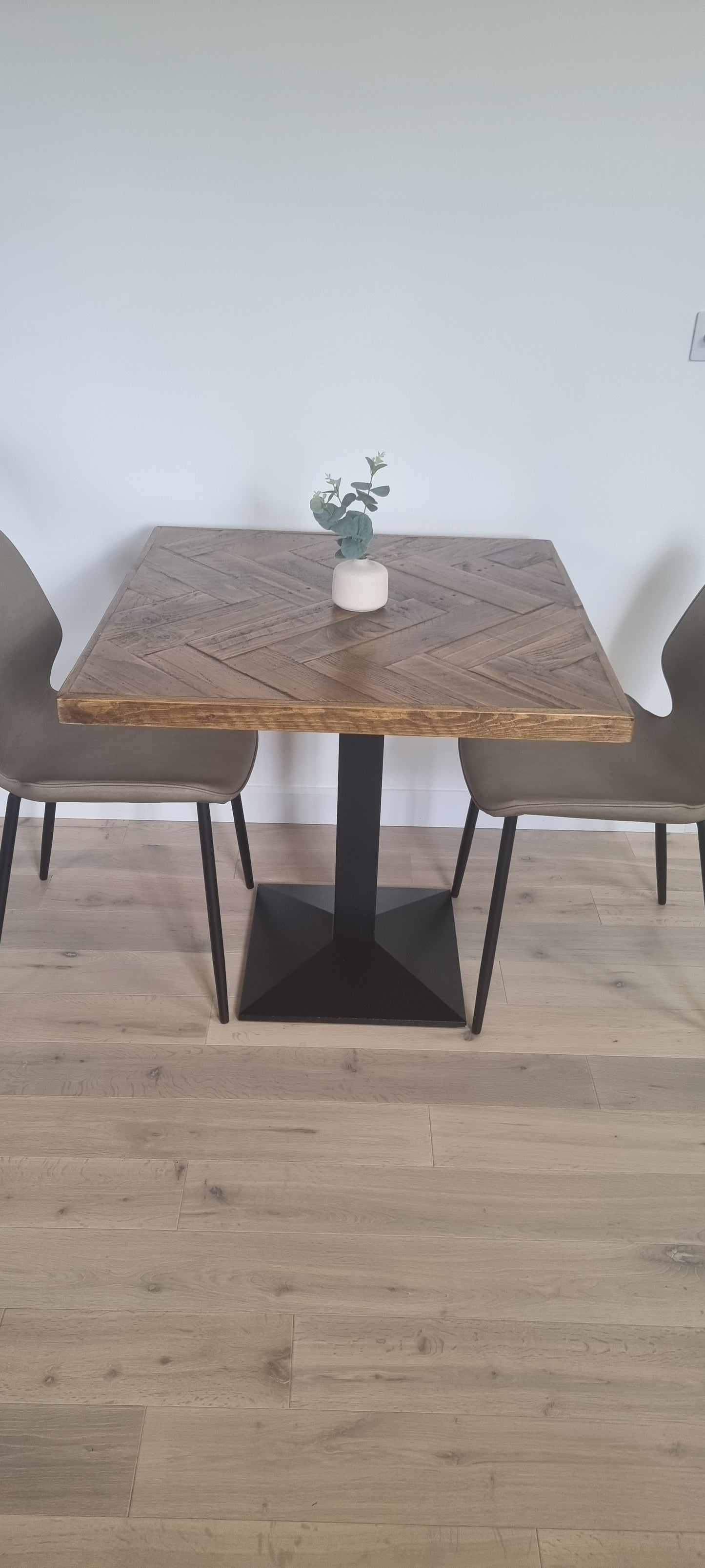 Bistro table in herringbone pattern with pedestal base