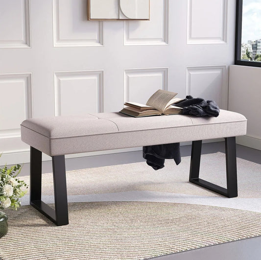 Upholstered bench with trapezium metal legs