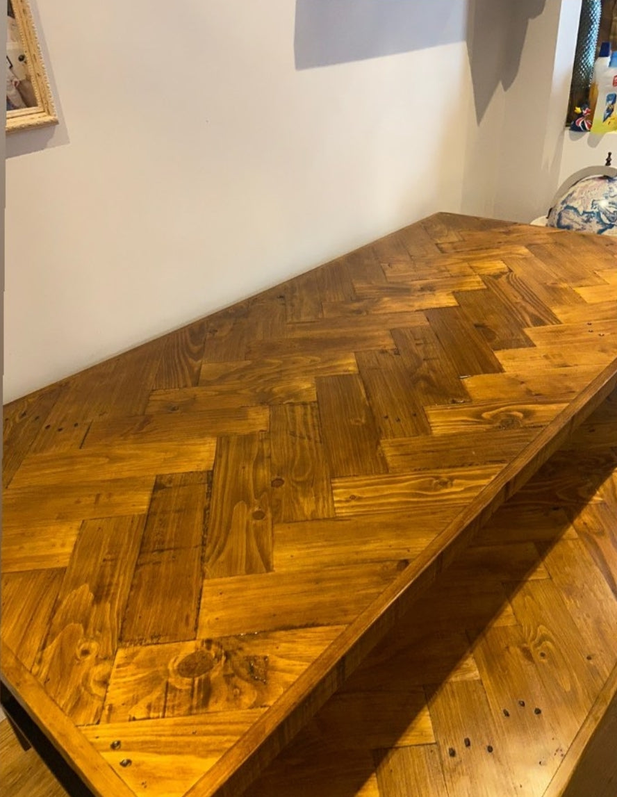 Double herringbone dining table with trapezium shape legs