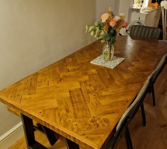 Double herringbone dining table with trapezium shape legs